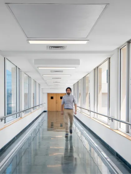 A glass-walled corridor at Max Super Speciality Hospital connects different blocks of the campus. The design allows for ample natural light and views, making the journey between departments a more pleasant experience.