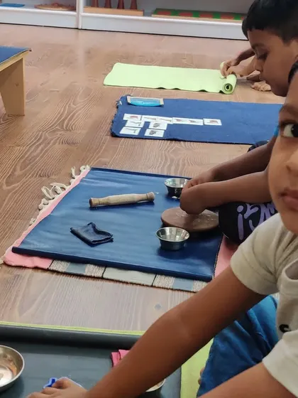 A snapshot of our classroom on the first day back. You can see children already absorbed in practical life activities and caring for their workspace.