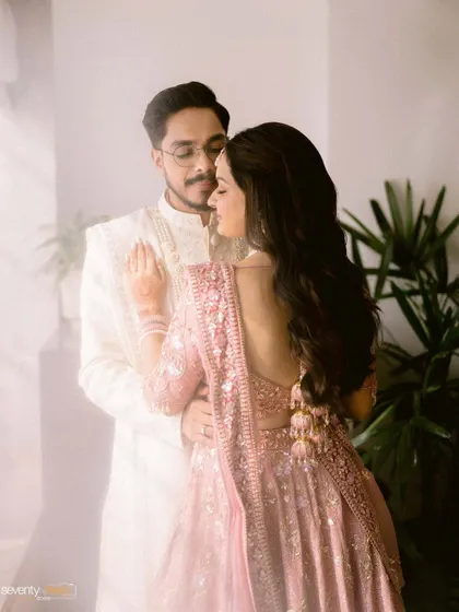 A soft, dreamy portrait of the couple, with a hazy, light-filled effect that gives the image a romantic and ethereal quality.