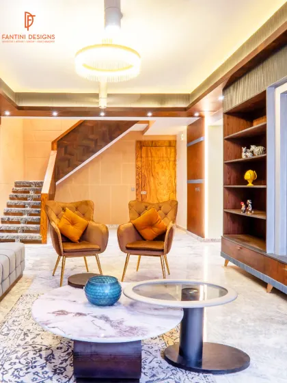 This angle highlights the room's architecture, including the staircase and ceiling details. I believe in designing the entire space, not just filling it with furniture, to ensure a harmonious flow.