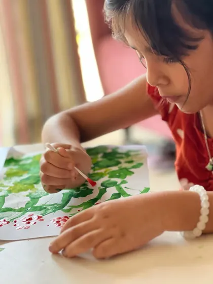 Using a cotton bud for pointillism. Sponge and bud painting is a fun sensory activity that produces beautiful, textured results.