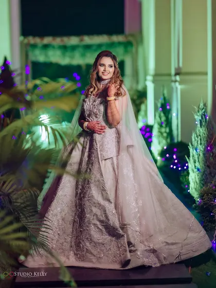 A solo portrait of the bride at her reception, looking elegant and happy.