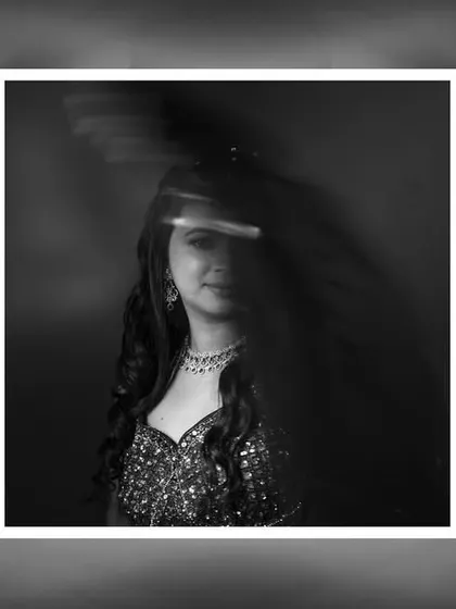 An abstract black and white bridal portrait with motion blur, creating a dynamic and artistic feel.