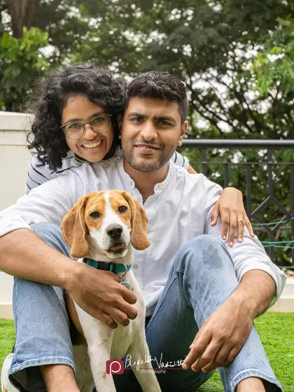 A classic family portrait with their handsome Beagle, Roger. Everyone looks so happy and relaxed.
