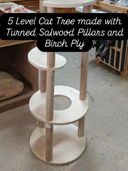 For the discerning feline, a 5-level cat tree built with sturdy turned Salwood pillars and smooth Birch plywood. This isn't just cat furniture; it's a custom-designed play-and-relax tower made to last.