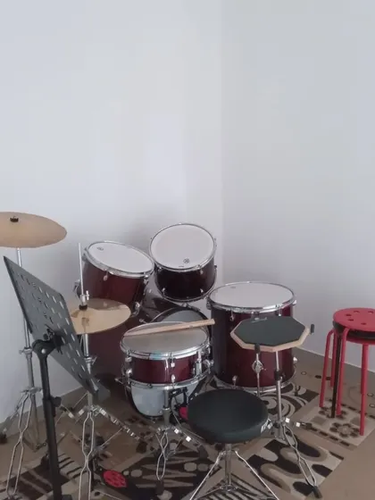 Our drum kit, ready for a student to come and find their rhythm.