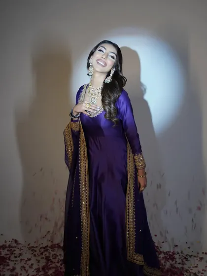 A joyful, candid moment that captures the beauty and elegance of the look.