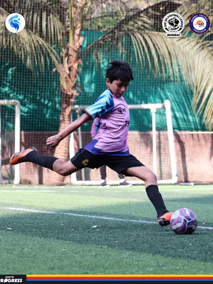 A player strikes the ball with power and precision. This is the result of dedicated practice and expert coaching.