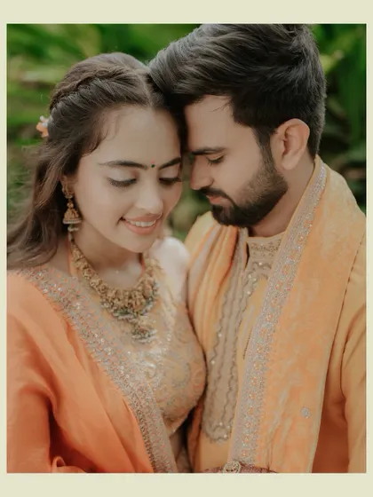 An intimate close-up of the couple, their faces close, capturing a serene and deeply romantic moment. The warm tones add to the photo's emotional depth.