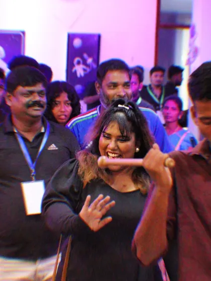 Crowd interaction is a huge part of our act. Here I am, making my way through the audience, ensuring everyone feels like they are part of the show.