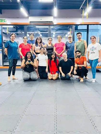 Group photo after our Yoga Day class at Volt Fitness Club, mats and blocks still on the floor.