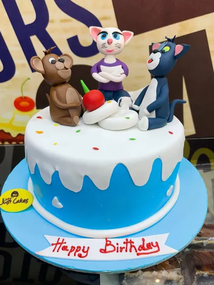 A 2.5kg cake featuring fondant figures of Tom, Jerry, and Angela for a classic cartoon fan.