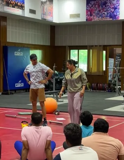 In conversation with a coach during a workshop. These one-on-one interactions are where we can dive deep into specific challenges and questions.