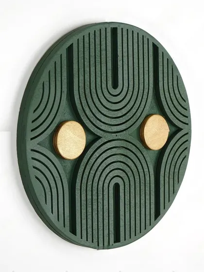 Our Radiant Sunburst geometric art in a deep green with golden accents. The design is inspired by art deco arches and adds a touch of vintage glamour.