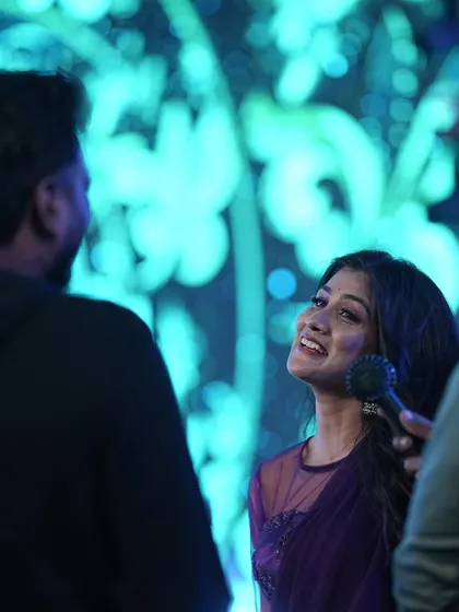 A moment of interaction with a contestant during a choreography session for Bigg Boss Kannada. Capturing the right emotion is just as important as the steps.