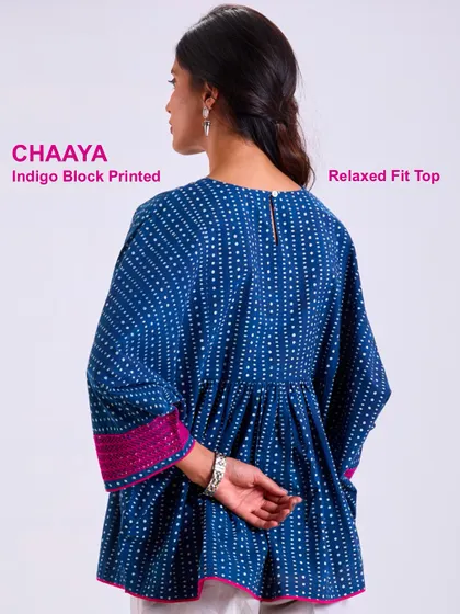 The back of our Chaaya relaxed fit top, showing the simple closure and the beautiful drape of the hand-block printed cotton. Easy, breezy, and made with care.