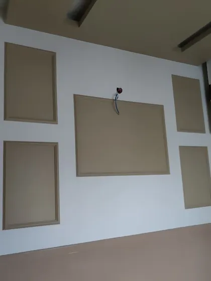 Here is a look at the wall and ceiling paneling work before the final coats of paint. Proper surface preparation is essential for achieving a high-quality, long-lasting finish.