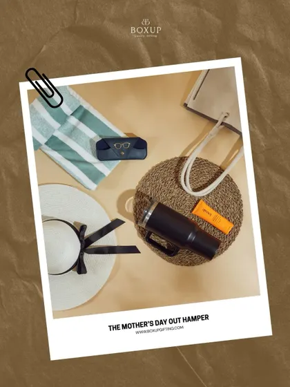 The 'Mother's Day Out' hamper is the perfect summer treat. It's packed with essentials for a day of relaxation, including a sun hat, tumbler, and sunscreen.