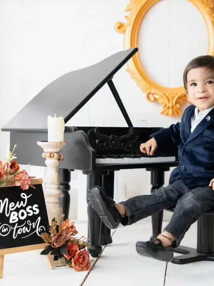 The new boss in town! This "Boss Baby" themed toddler shoot is full of personality, featuring a sharp suit and a mini piano for a touch of class.