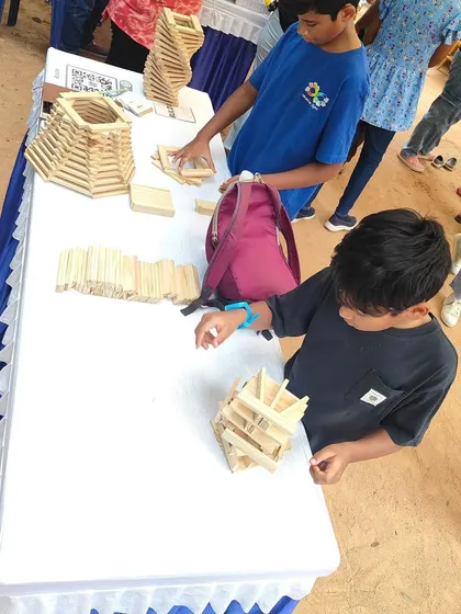 The workshop floor is a dynamic space of interaction. Children, parents, and mentors all come together, sharing ideas and learning from one another. This collaborative environment is where some of the best building and bonding happens.