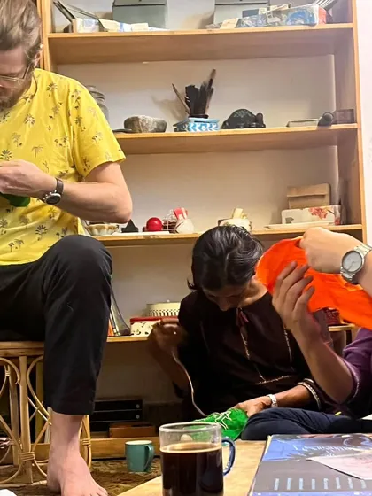 Parents completely absorbed in their embroidery work. These gatherings are a chance to slow down, focus our hands, and connect with one another in a calm and creative atmosphere.
