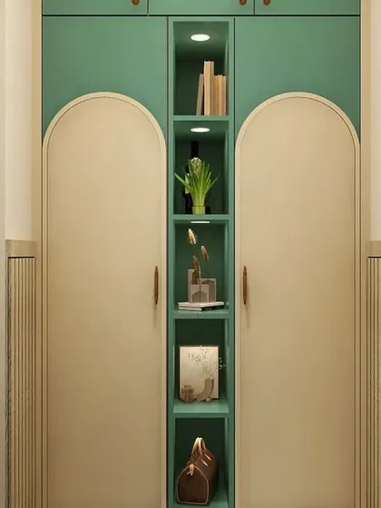 A detailed shot of the arched wardrobe with its central display shelves, adding a decorative and personal element to the room.