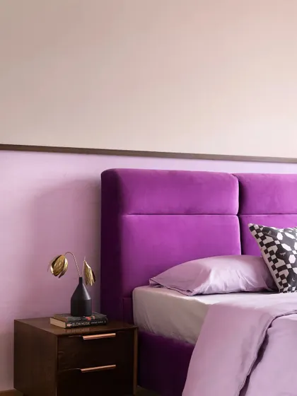 A duplicate of 242, showing the purple headboard.