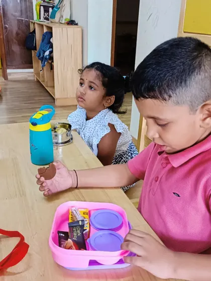 A duplicate of a previous image, showing children at snack time.