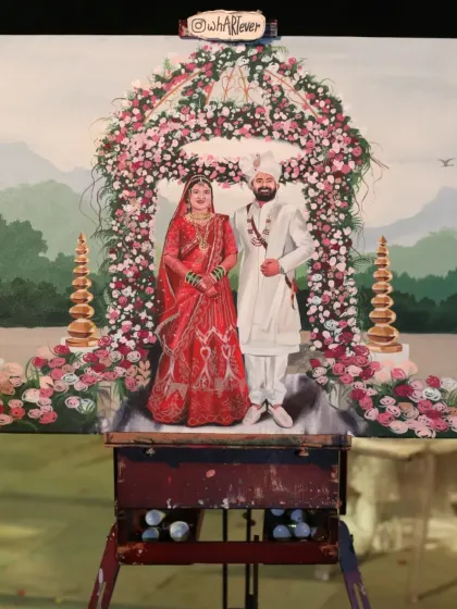 This live wedding painting captures a fairytale wedding in the beautiful hills of Mahabaleshwar. The floral arch and mountain scenery created a truly magical setting for the couple's portrait.