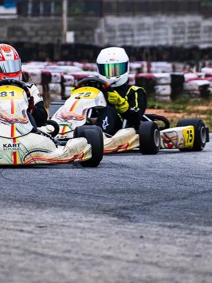 Two of our drivers battling for position, showcasing their competitive spirit.