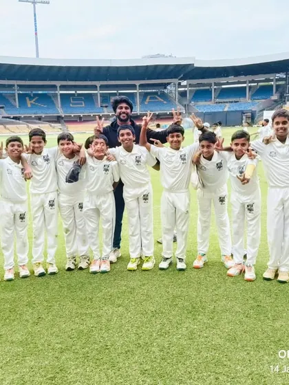 A victorious team photo at the iconic KSCA stadium after winning a U-12 league match.