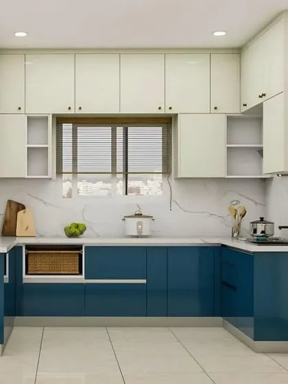 This beautiful U-shaped kitchen features deep blue base cabinets and white upper cabinets. The white marble-effect countertop and backsplash tie the two colors together perfectly.