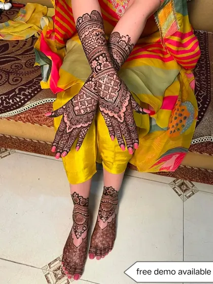 A complete bridal look showing intricate mehndi on both hands and feet. I offer a free demo so you can be confident in the quality of my work for your big day.