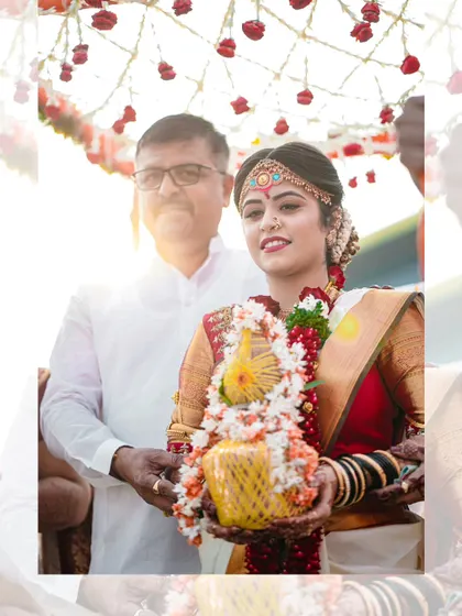 A touching moment between the bride and her father as he walks her down the aisle, captured with beautiful backlighting.