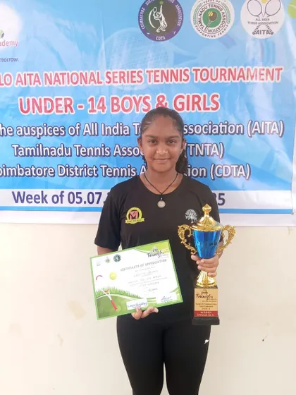 Our champion Eshita with her winner's trophy and certificate at the AITA National Series Under 14 tournament in Coimbatore.
