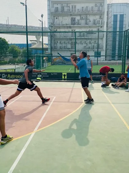 A player looks to pass to an open teammate, showcasing the importance of court vision.