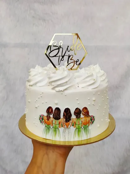 A sweet cake for a bride and her bridesmaids. The edible image shows the bride with her friends, making it a personal and memorable cake.
