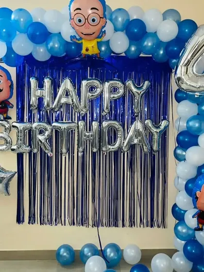 A fun party setup with characters from the Indian cartoon Motu Patlu. The blue and silver theme is perfect for a simple home celebration.