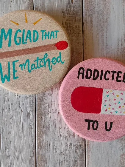 Quirky and fun magnets for your special someone. "I'm glad that we matched" and "Addicted to U" are playful, hand-painted tokens of affection.