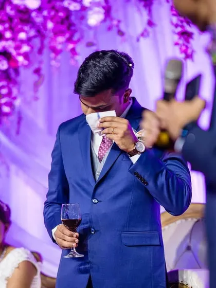 The best man gets emotional during his speech, a moment of heartfelt friendship and love. Capturing these candid reactions from guests is a key part of the story.