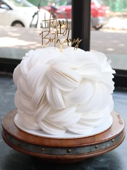 This cake is all about modern texture and minimalist beauty. I used delicate, paper-thin wafer paper to create this stunning, all-white feathered effect. It's a simple yet incredibly artistic design for any sophisticated celebration.
