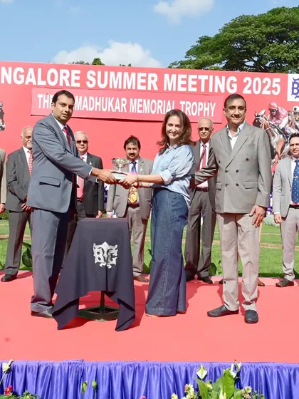 Mr. Rohit S Madhukar presents The S.G. Madhukar Memorial Trophy to the owner of Bishop.