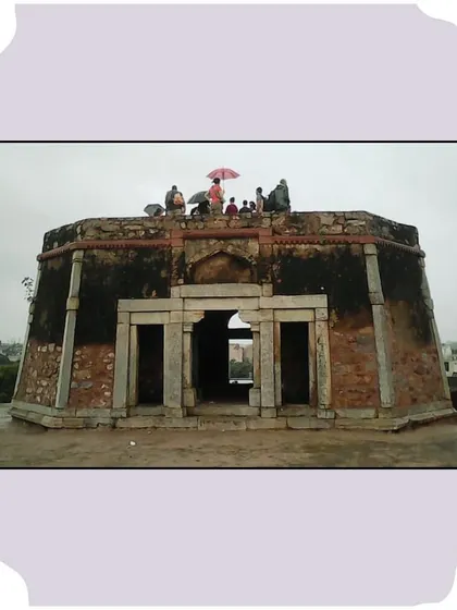 A group sits atop the octagonal pavilion of Bijay Mandal. This structure offers a panoramic view and is a highlight of our Jahanpanah walk.
