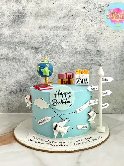 A slice of the world in every bite! This travel-themed cake is perfect for the wanderer at heart, featuring a globe, airplanes, and signs for favorite destinations.