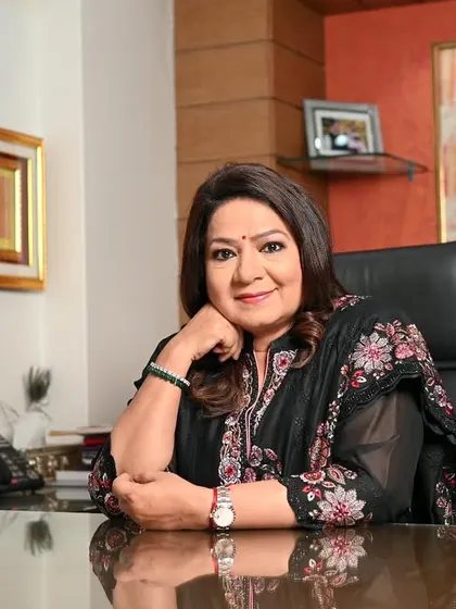 A thoughtful and confident pose from Mrs. Prasad's branding photoshoot. The composition highlights her poise and experience as a leader in her field.