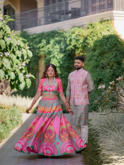 A candid moment of the bride twirling in her colorful lehenga at Sula Vineyards. We love capturing movement and joy, showing off the beauty of the outfit and the happiness of the moment.