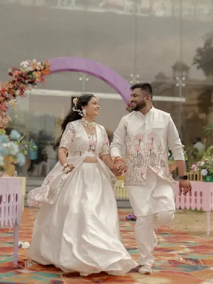 Umang and Muskaan making their joyful entrance at their Haldi ceremony. This photo captures their happiness and excitement as they walk hand-in-hand, ready to celebrate.