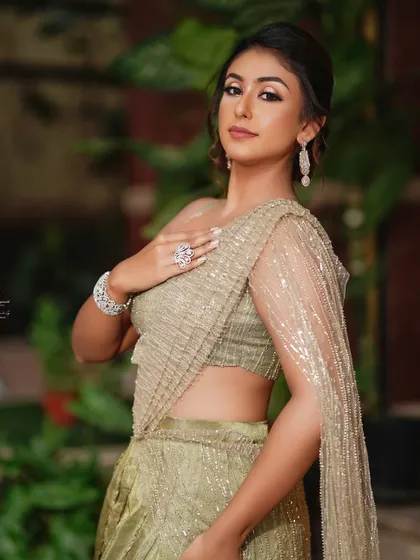An elegant, understated look with an olive green lehenga. Soft glam makeup is a very popular and requested style.
