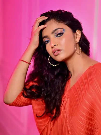 For this look, I combined a colorful graphic liner with strategically placed rhinestones for a playful and artistic vibe, perfect for a music festival or creative photoshoot.