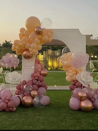 The complete view of the freestanding arch, a perfect statement piece for an elegant outdoor celebration like a bridal shower.